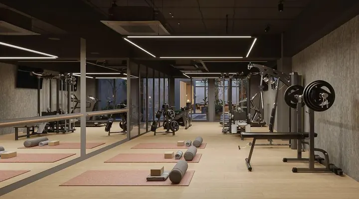 Gimnasio con pesas y tapetes en VEQ Asunción